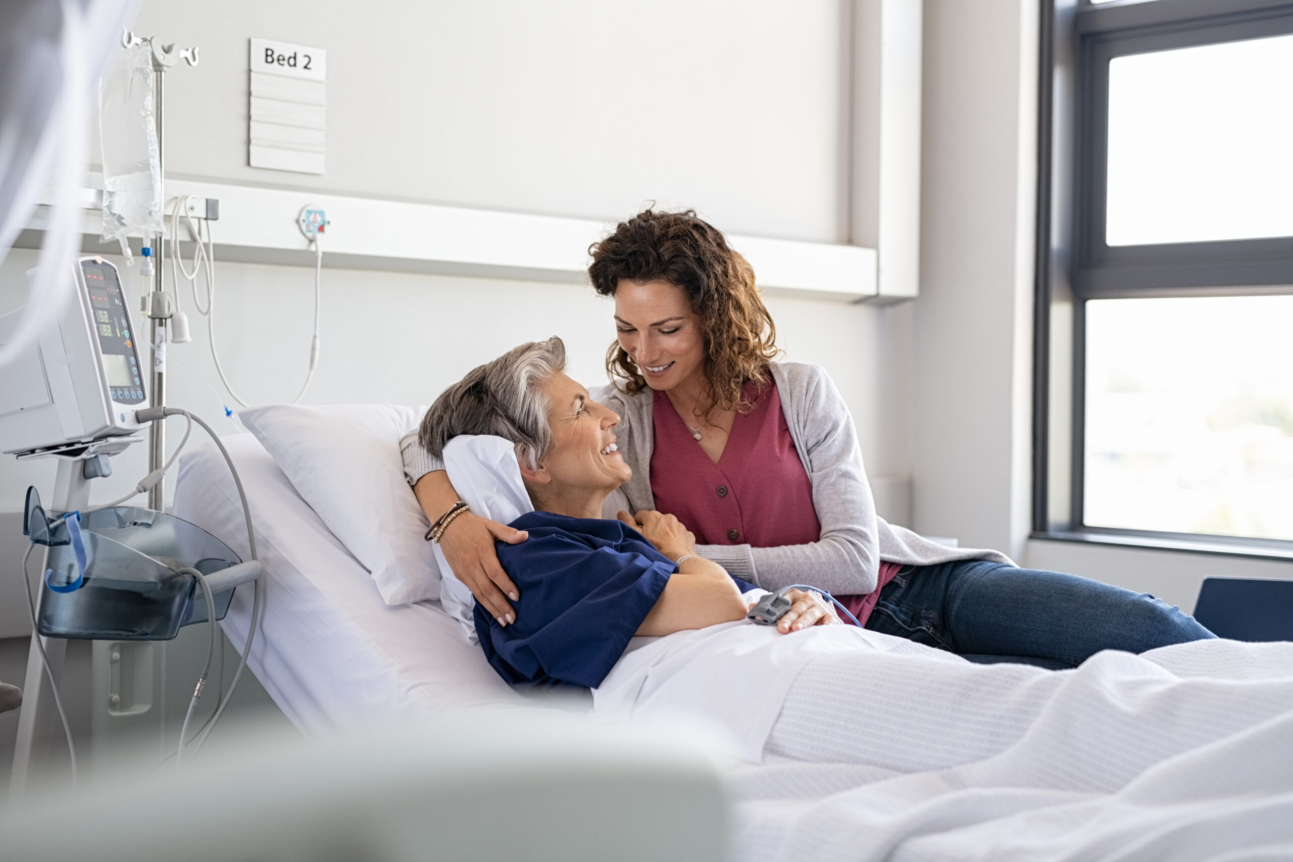 Daughter visiting mother in hospital